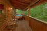 4 bedroom cabin with hot tub and wooded view