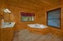 Cabin with Private Jacuzzi Tub in Master Bedroom